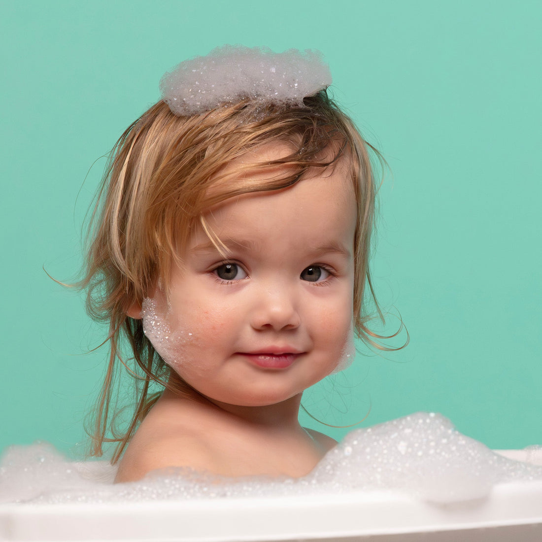 How do I wash and take care of my baby's hair?